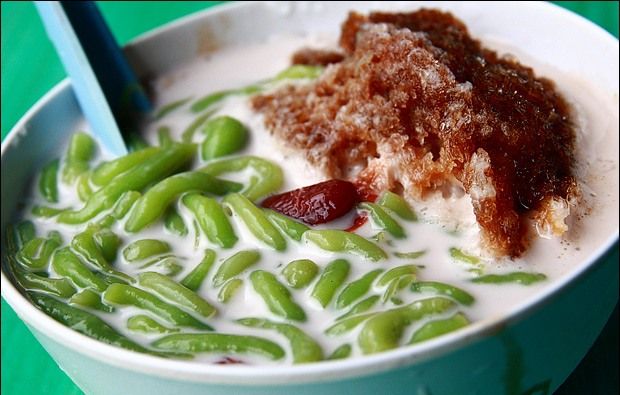 Cendol is an iced sweet dessert that contains droplets of green rice flour jelly, coconut milk and palm sugar syrup.